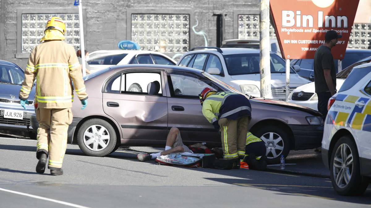 Injuries after car driven into people when gang brawl sprawls across street