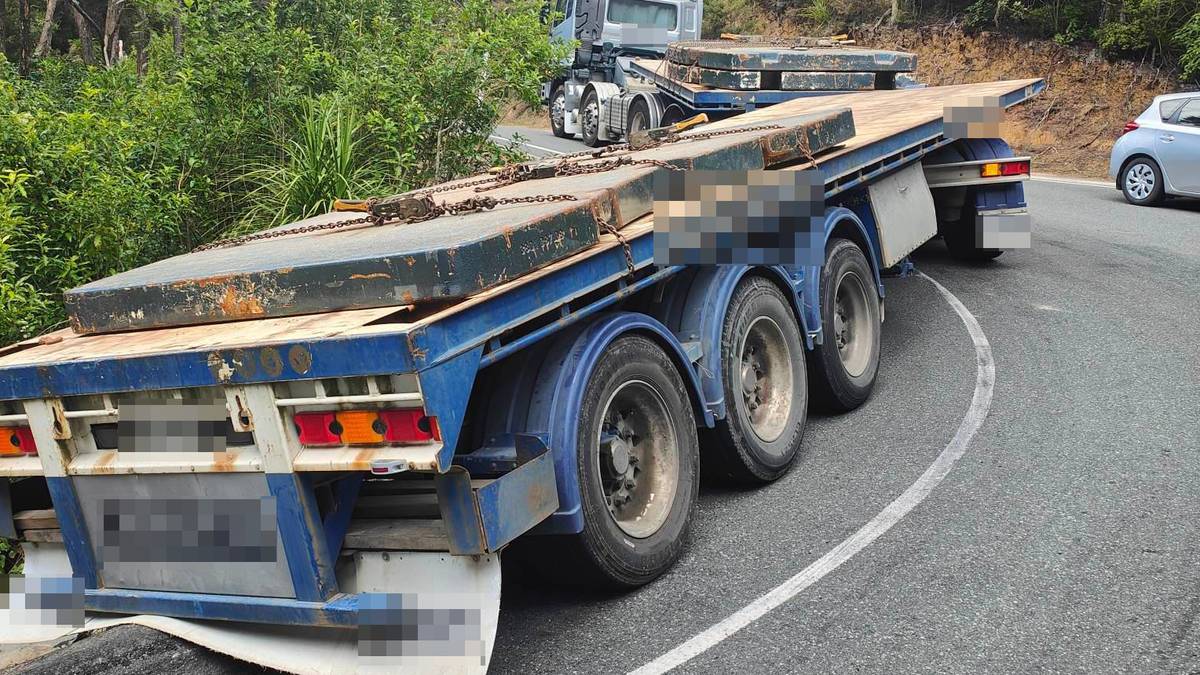 Truck and trailer stuck on Cove Rd, two days after Civil Defence ban